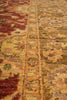 Load image into Gallery viewer, Close-up of a patterned rug with warm colors
