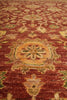 Load image into Gallery viewer, Close-up of a patterned red rug with intricate designs