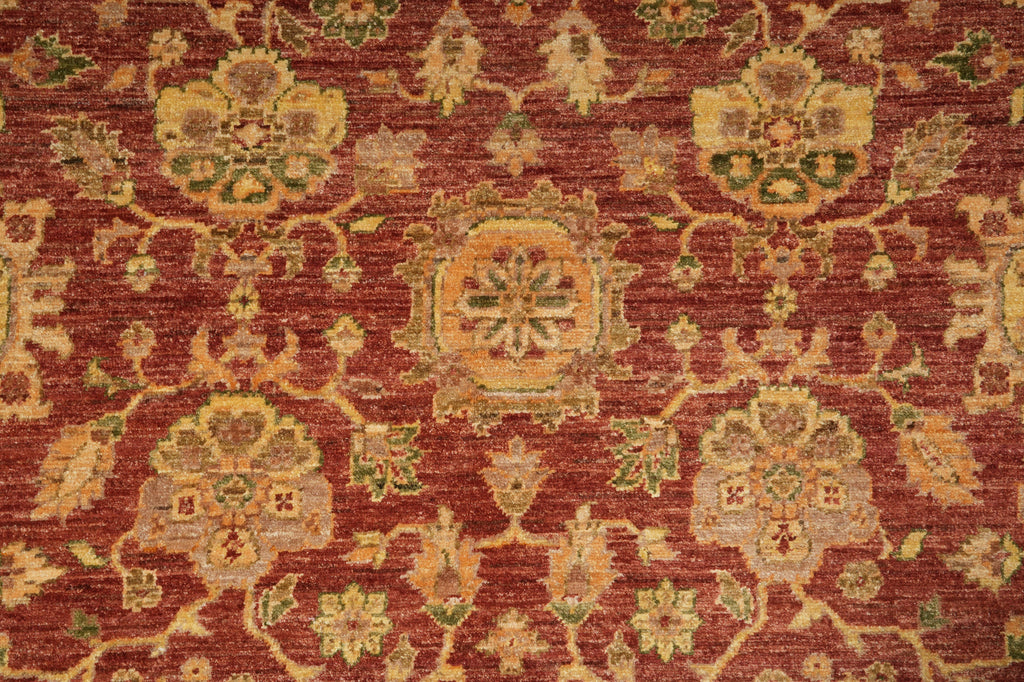 Close-up of a red patterned rug with intricate designs