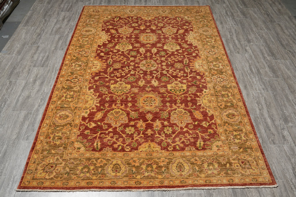 Decorative rug with intricate patterns on a wooden floor