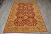 Load image into Gallery viewer, Decorative rug with intricate patterns on a wooden floor