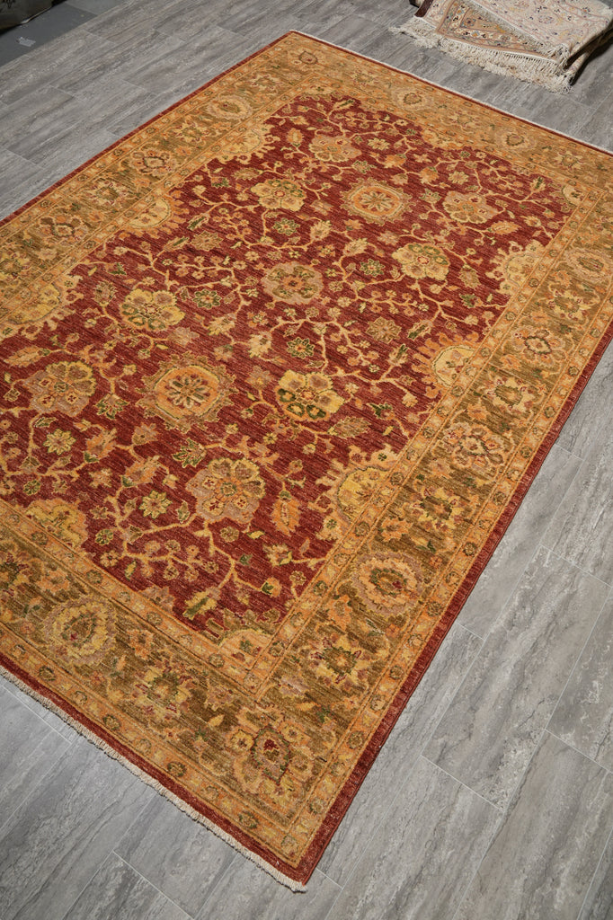 Decorative rug with intricate patterns on a wooden floor
