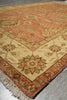 Load image into Gallery viewer, Close-up of a patterned rug with geometric design on a wooden floor.