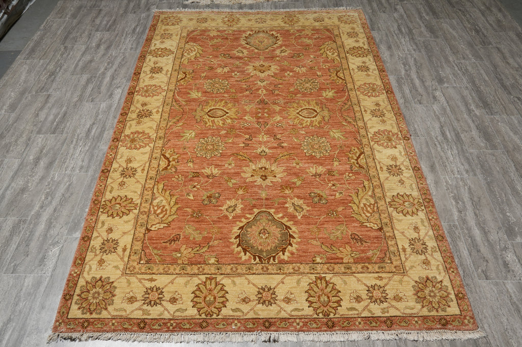 Decorative rug with intricate patterns on a wooden floor