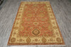 Load image into Gallery viewer, Decorative rug with intricate patterns on a wooden floor