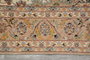Load image into Gallery viewer, Close-up of an intricately designed rug with floral patterns on a beige background.