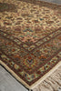 Load image into Gallery viewer, Close-up of a patterned rug with fringes on a neutral background