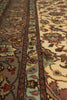 Load image into Gallery viewer, Close-up of a patterned rug with intricate designs.