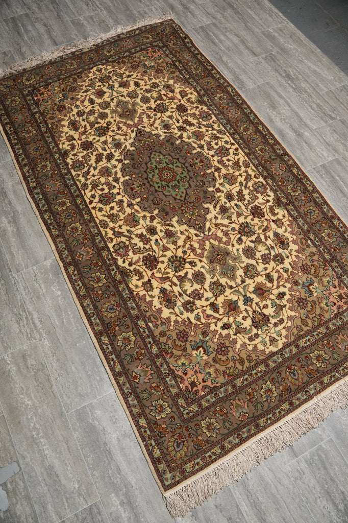 Decorative rug with intricate patterns on a gray floor