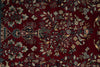 Load image into Gallery viewer, Close-up of a patterned rug with floral and bird designs on a red background