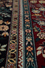 Load image into Gallery viewer, Close-up of a patterned fabric with floral and geometric designs.