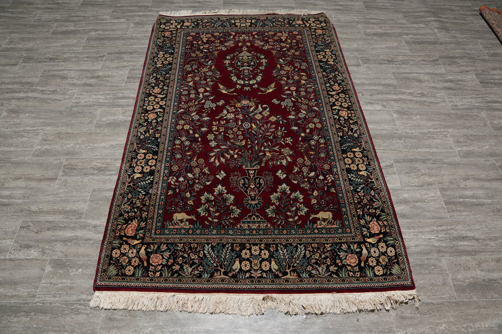 Decorative rug with intricate patterns on a wooden floor