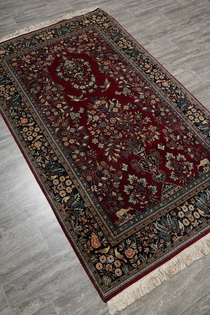 Decorative rug with intricate patterns on a wooden floor