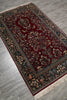 Load image into Gallery viewer, Decorative rug with intricate patterns on a wooden floor