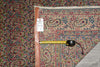 Load image into Gallery viewer, Decorative rug with a measuring tape and label on a textured surface