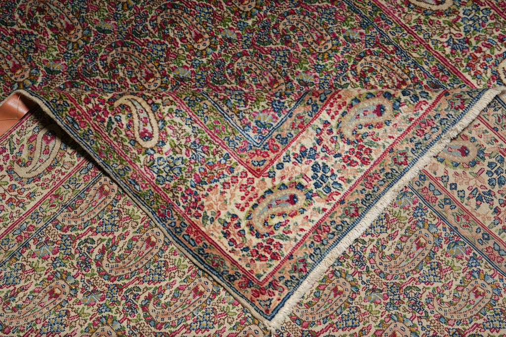 Close-up of a patterned rug with intricate designs.