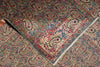 Load image into Gallery viewer, Close-up of a patterned rug with intricate designs.