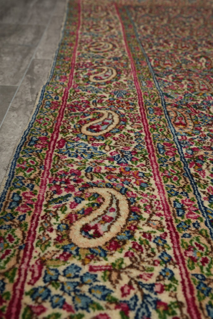 Close-up of a colorful patterned rug with intricate designs.