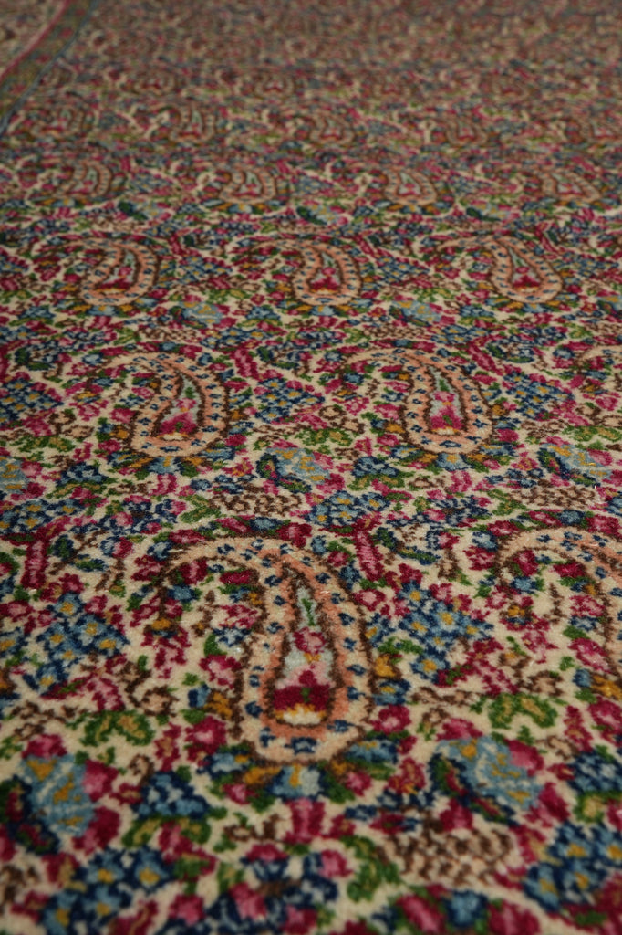 Close-up of a colorful patterned fabric with intricate designs.