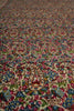 Load image into Gallery viewer, Close-up of a colorful patterned fabric with intricate designs.