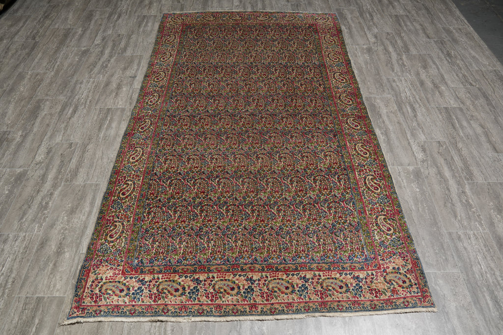 Decorative rug with intricate patterns on a wooden floor