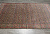 Load image into Gallery viewer, Multicolored patterned rug on a wooden floor