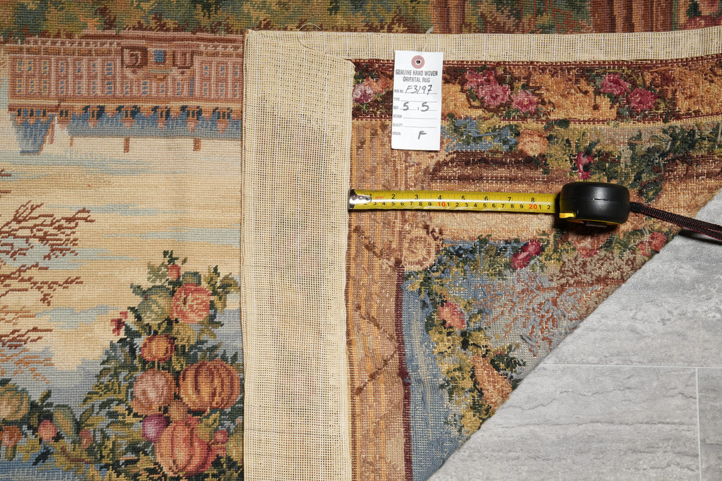 Decorative rug with floral patterns and a measuring tape on a textured surface