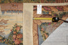 Load image into Gallery viewer, Decorative rug with floral patterns and a measuring tape on a textured surface