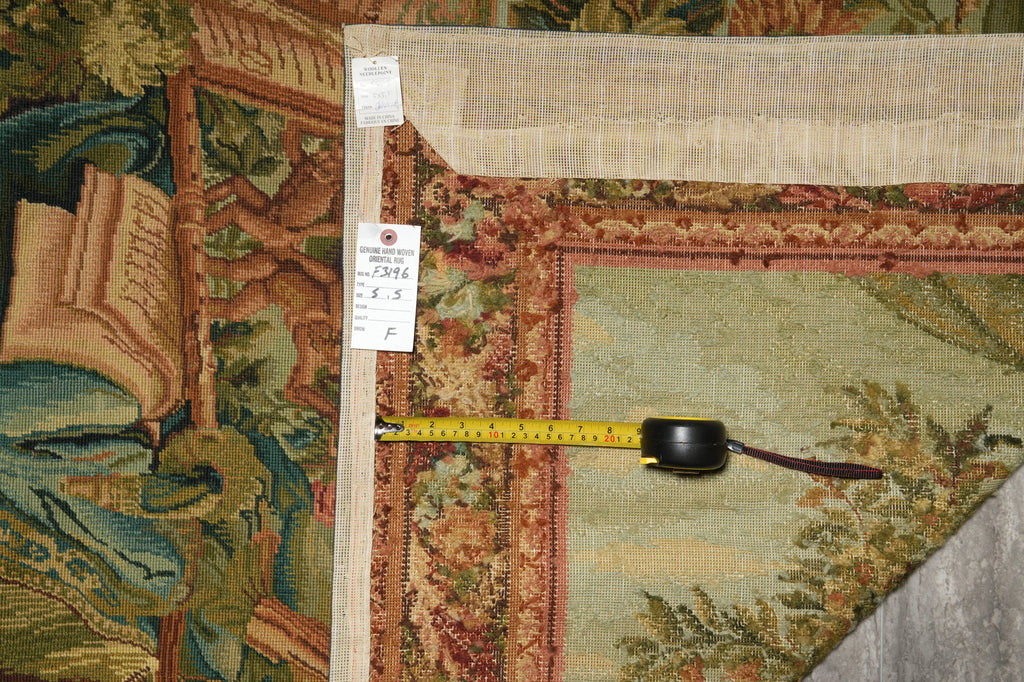 Decorative rug with intricate patterns and a measuring tape on top