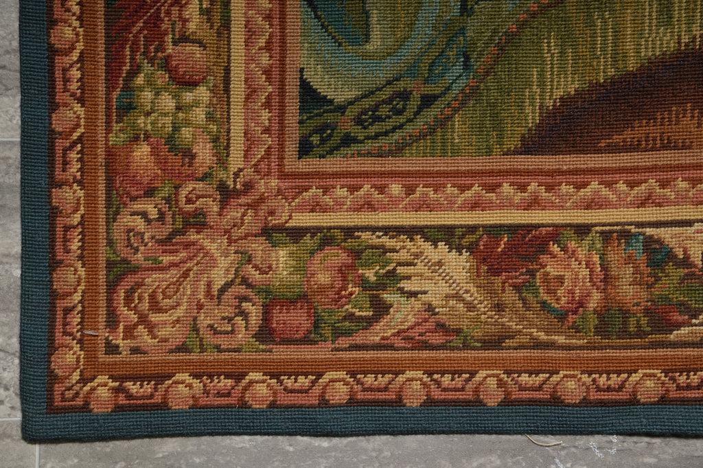 Close-up of a detailed tapestry with intricate patterns and colors.