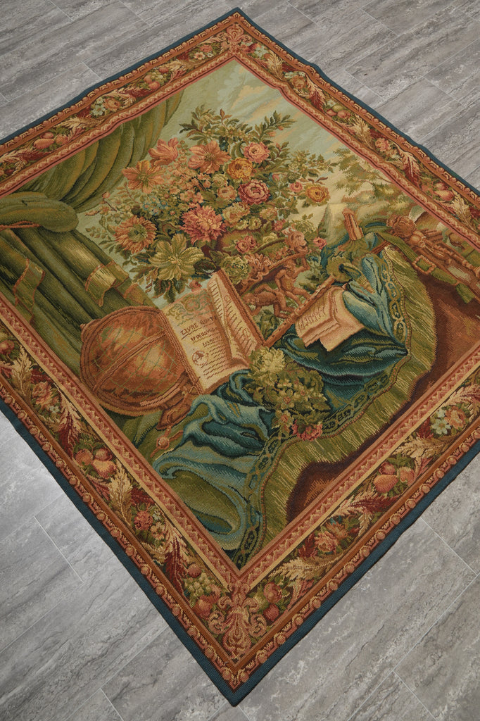 Decorative rug with floral and book design on a wooden floor