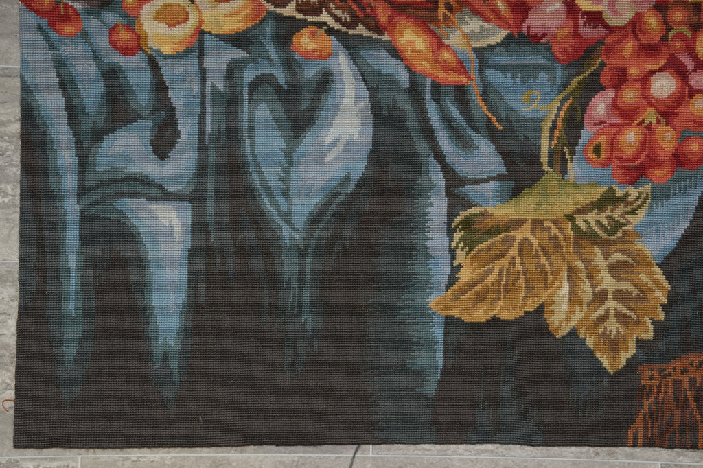 Decorative rug with floral and leaf patterns on a textured surface