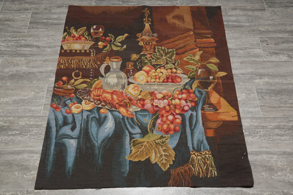 Decorative rug with a still life design of fruits and flowers on a wooden floor.