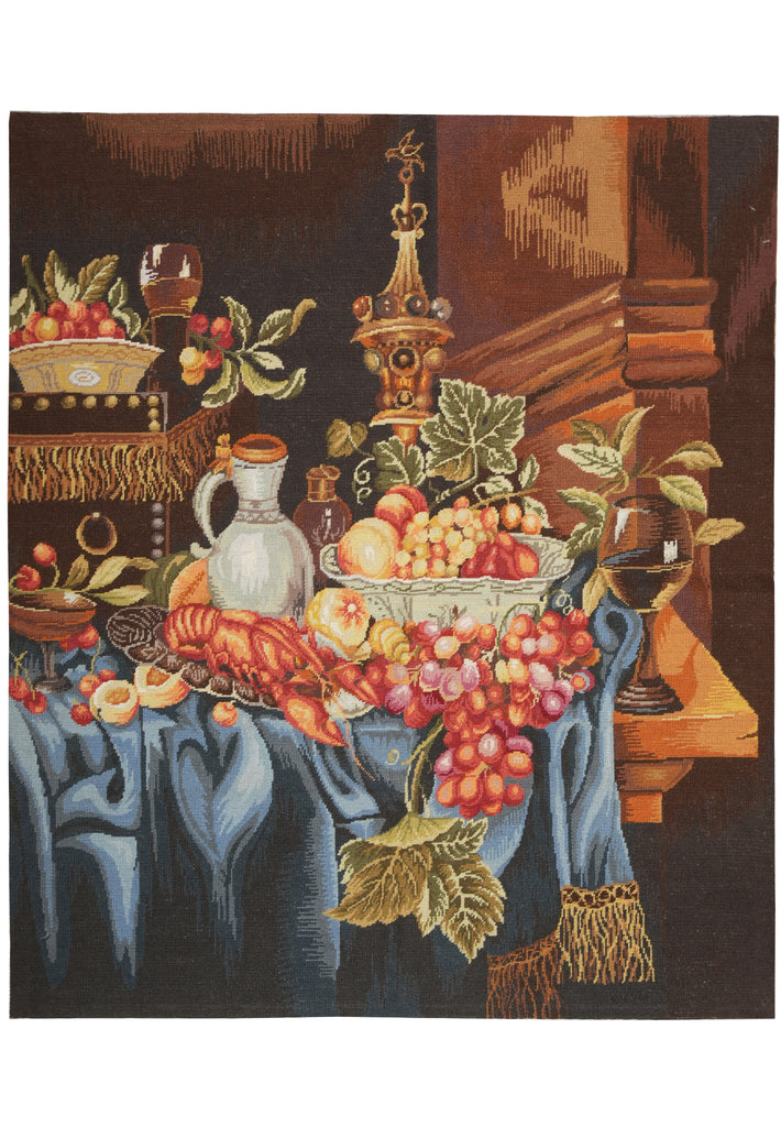 Tapestry of a still life scene with fruits, flowers, and a candlestick.