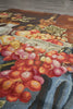 Load image into Gallery viewer, Close-up of a floral tapestry with vibrant colors on a wooden surface.
