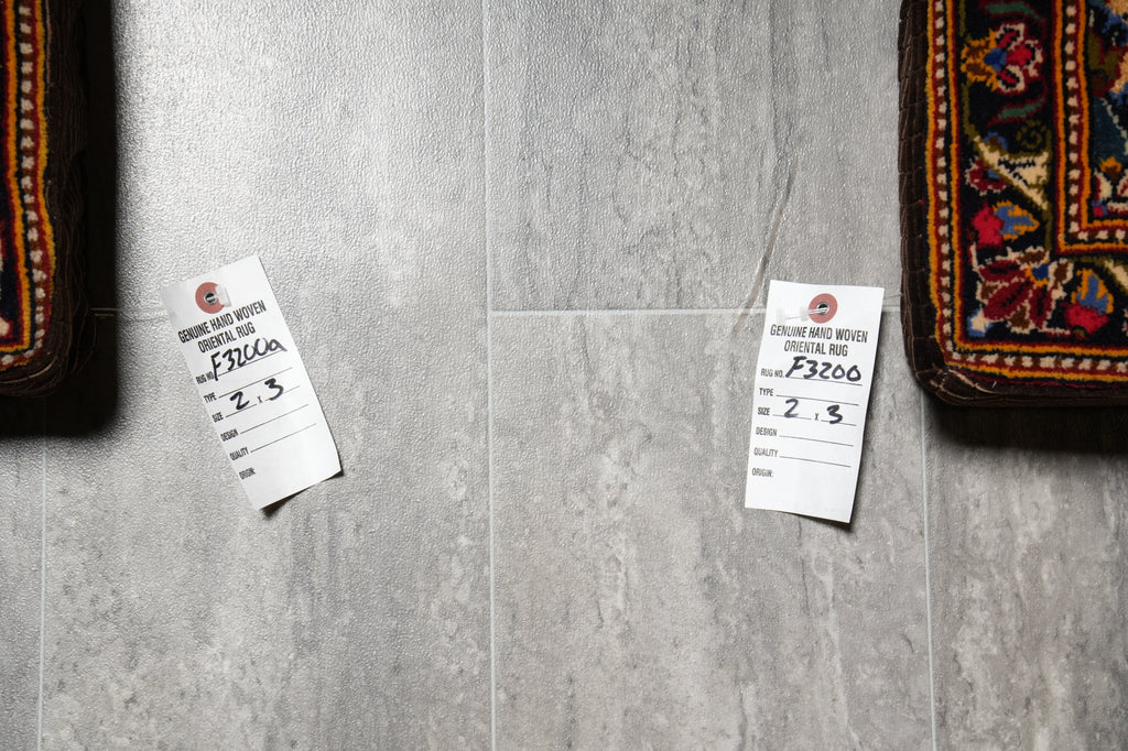 Gray tiles with price tags on a floor