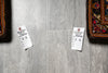 Load image into Gallery viewer, Gray tiles with price tags on a floor