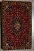Load image into Gallery viewer, Decorative rug with intricate patterns on a wooden floor