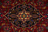 Load image into Gallery viewer, Close-up of a patterned rug with intricate designs on a red background