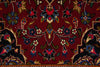 Load image into Gallery viewer, Close-up of a patterned rug with intricate designs on a red background