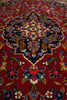 Load image into Gallery viewer, Close-up of a patterned rug with intricate designs on a red background