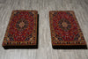 Load image into Gallery viewer, Two ornate, red and gold patterned cushions on a gray wooden floor.