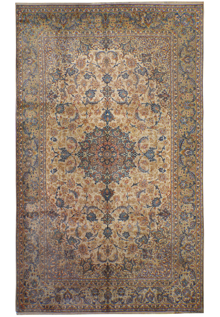 A traditional oriental-style area rug with an intricate floral and medallion pattern in beige, brown, blue, and muted red tones, shown flat against a white background.