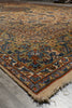 Load image into Gallery viewer, A close-up view of an oriental-style area rug with a traditional floral pattern, featuring a beige base with blue, red, and brown details, shown on a gray tiled floor.