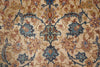 Load image into Gallery viewer, Close-up of an ornate floral patterned rug with a beige background and blue, rust, and brown motifs.
