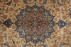 Load image into Gallery viewer, A close-up of an ornate traditional patterned rug with a central medallion and floral motifs in beige, blue, rust orange, and green.
