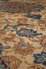 Load image into Gallery viewer, Close-up of an ornate area rug with a traditional floral pattern in beige, blue, brown, and rust tones.