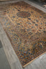 Load image into Gallery viewer, An antique Persian-style area rug with a floral pattern, displayed diagonally on a gray tiled floor.