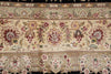 Load image into Gallery viewer, A close-up of an ornate floral patterned rug or textile with cream, beige, burgundy, green, and brown detailing, showing repeating botanical motifs and borders.