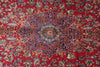 Load image into Gallery viewer, A close-up of a traditional Persian-style rug featuring a vibrant red background with a central medallion and intricate floral motifs in blue, beige, and gold.